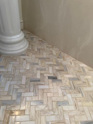 A close up of the main level bathroom tile flooring.