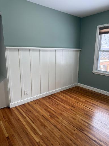 A view of the same bedroom without furniture. Such a beautiful room.