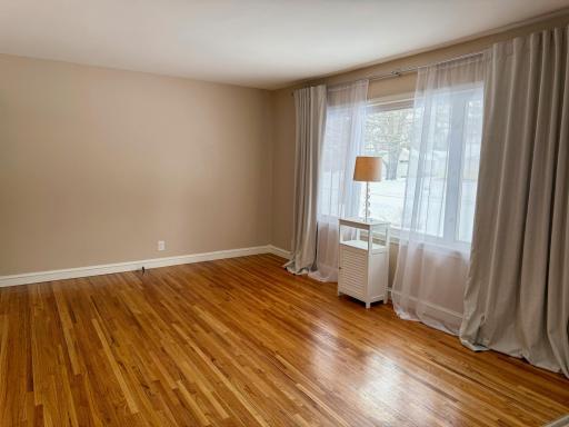 Another view of the living room, showcasing the beautiful neutral walls & floors.