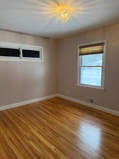 Primary bedroom shown as vacant. Higher windows have blackout material on them.