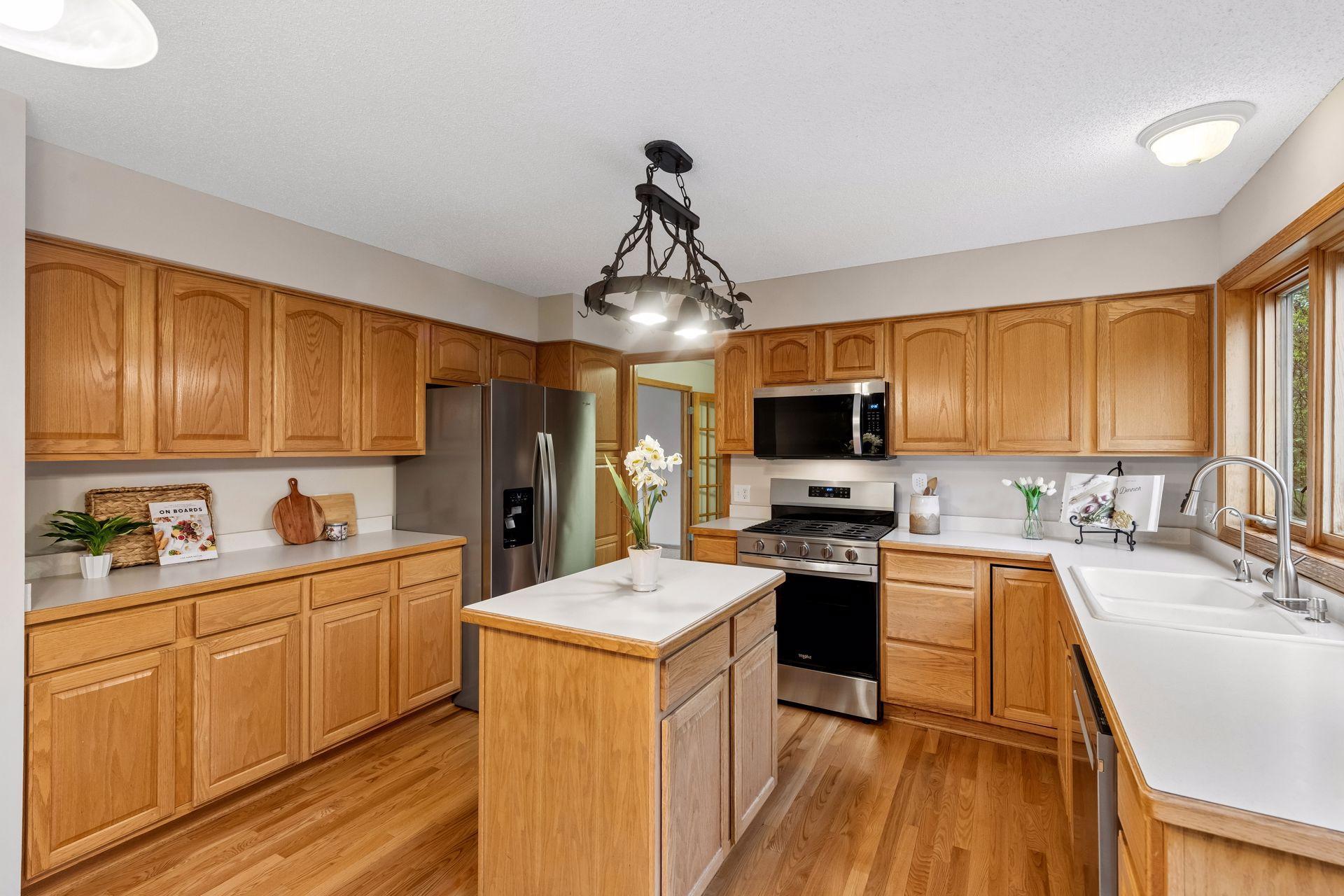 The kitchen has ample storage and beautiful sightlines to the dining and living areas.