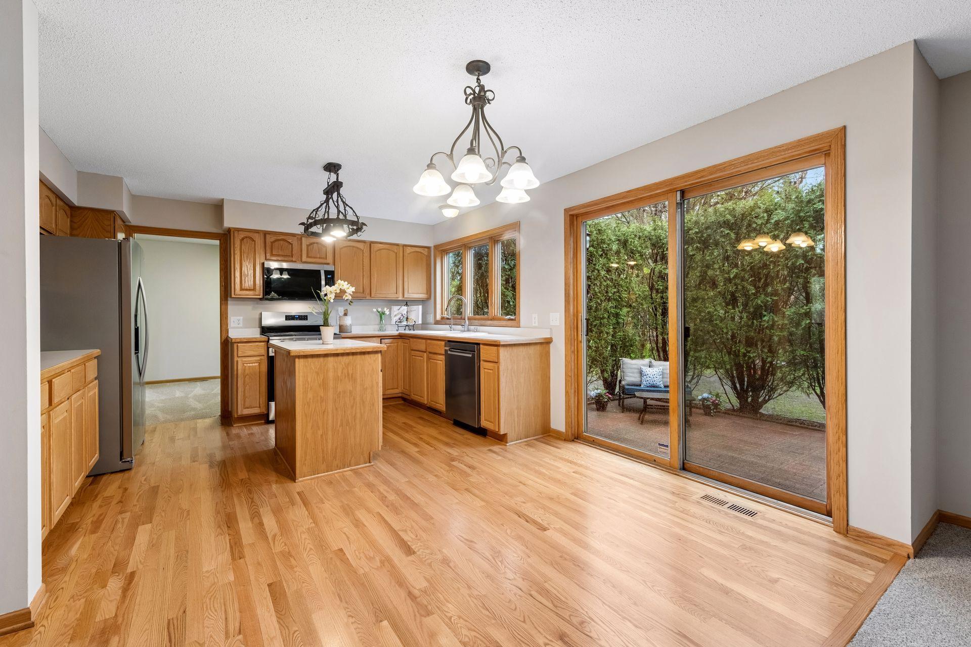 Open-concept kitchen featuring oak cabinetry and center island