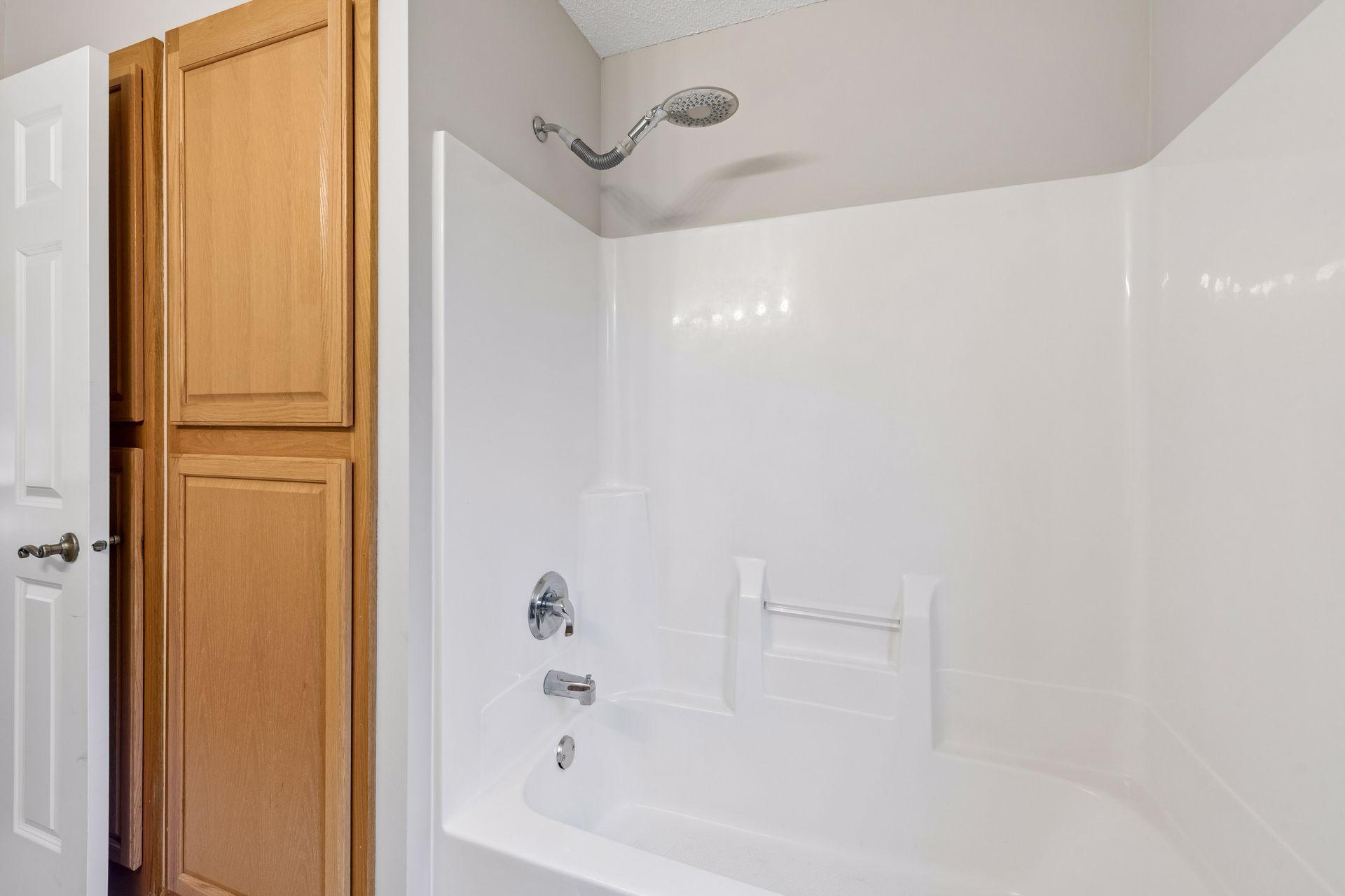 A full size linen closet creates a large space for storage