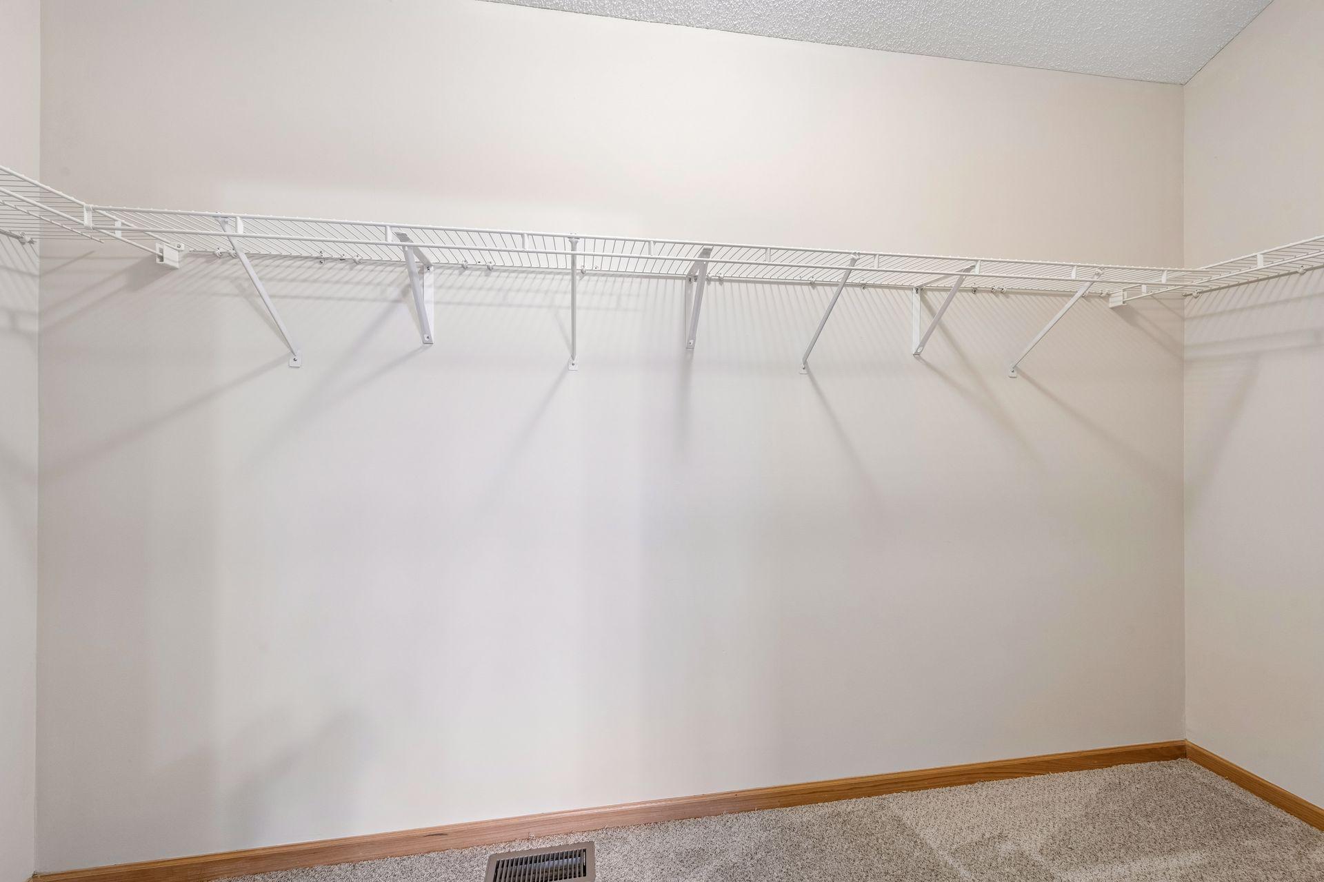 Expansive walk-in closet with built-in shelving