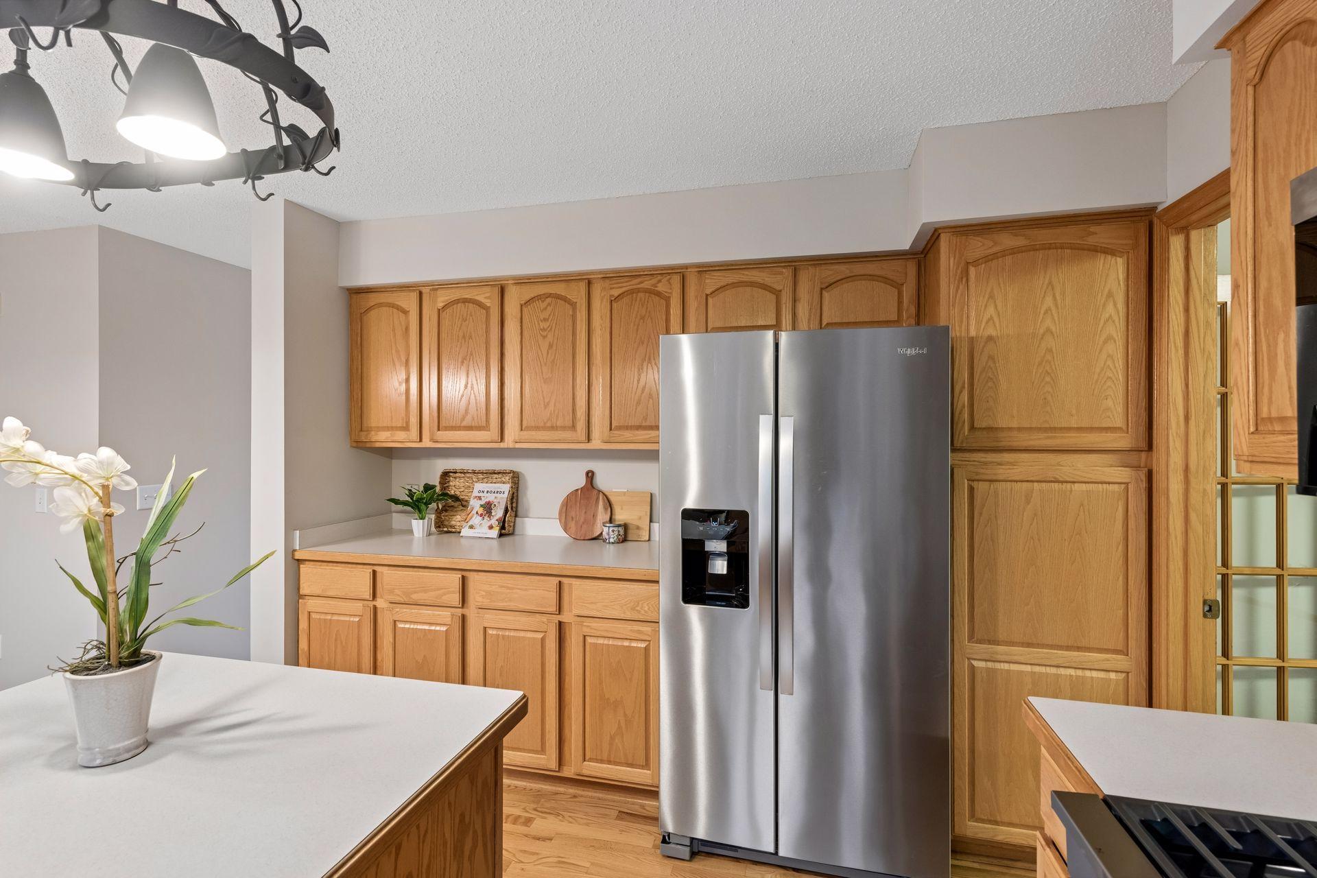 Separate buffet or bar service area for entertaining and an oversized pantry for extra storage.