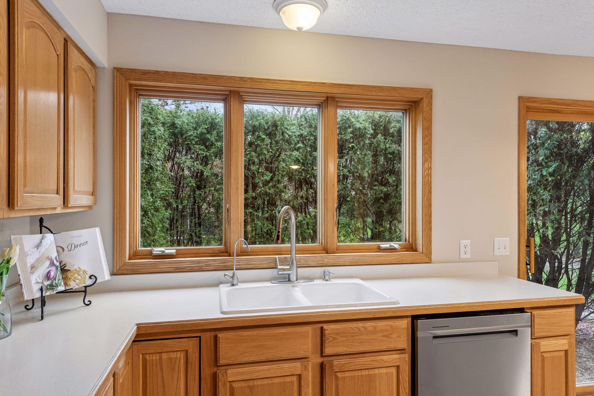 The oversized kitchen window looks out onto the private patio.