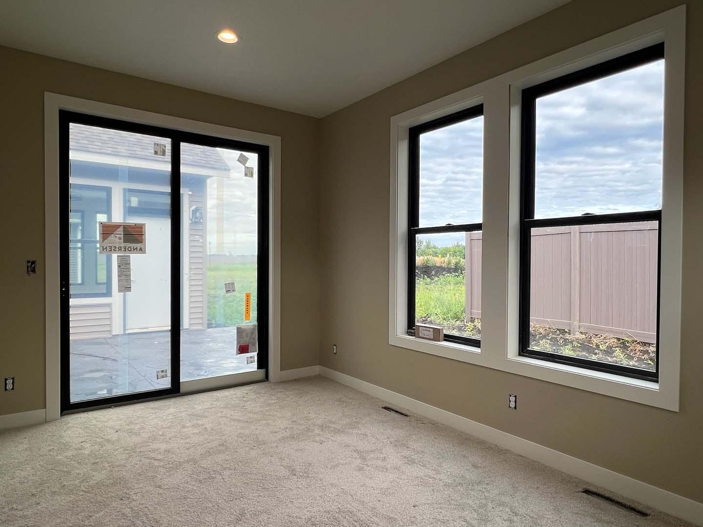 Primary bedroom sitting room with view of courtyard
