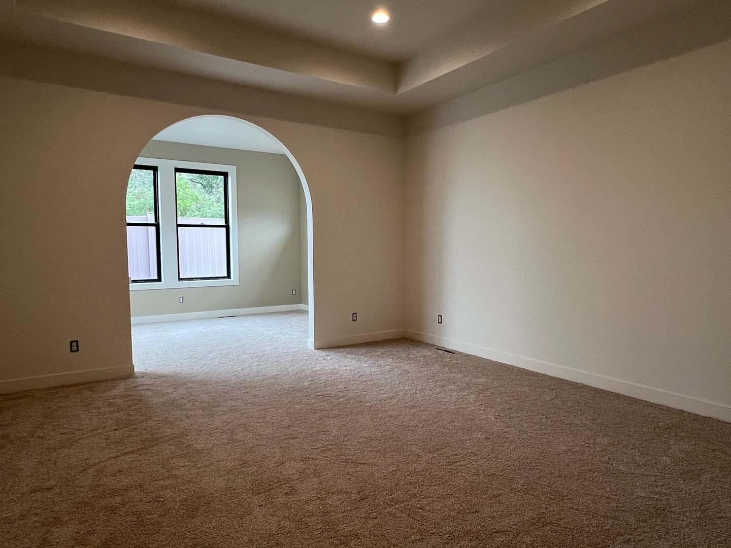 Primary bedroom with view of sitting room