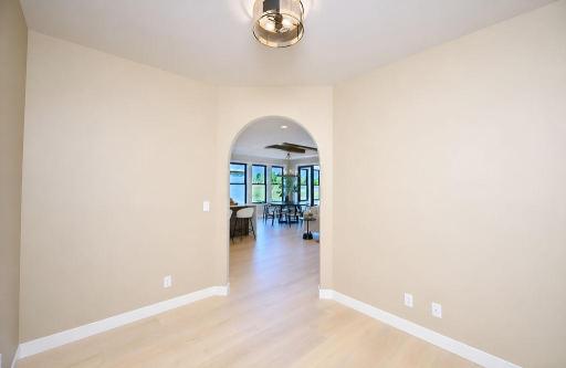 6448-Den with view of dining and 3 season roomen-office-view.jpg