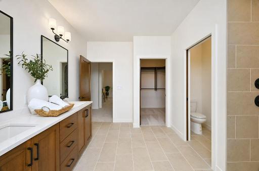 6448-Primary bedroom overlooking entry into walk in closetd-horace-ranch-sunset-torino-primary-bathroom-view-2.jpg