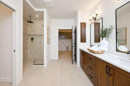 6448-Primary bath overlooking entry into laundry roomblvd-horace-ranch-sunset-torino-primary-bathroom.jpg