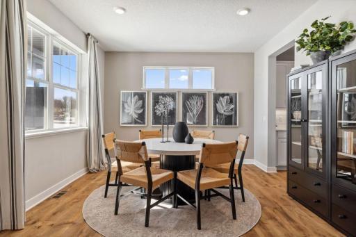 Formal dining room, with nearby butler's pantry perfect for entertaining! Model home, color and finish will vary.