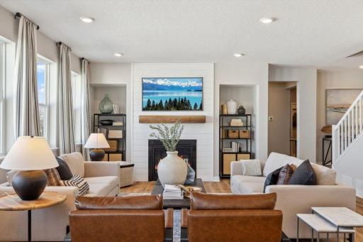 Cozy gas fireplace and space to gather and relax. Model home, color and finish will vary.