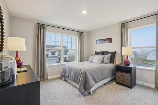 Each of the home's secondary bedrooms are spacious and filled with natural light. Photo of model, colors and options will vary.