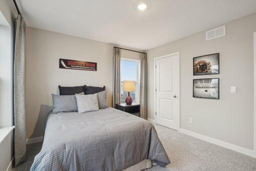 Each of the home's secondary bedrooms are spacious and filled with natural light. Photo of model, colors and options will vary.