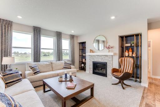 There's plenty of room for a sectional or large couches, and side chairs in this living room! Photo of model home, colors and finishes are similar.