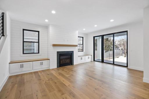Light a bright living room with plenty of windows for natural light. Pictures of previously built house.