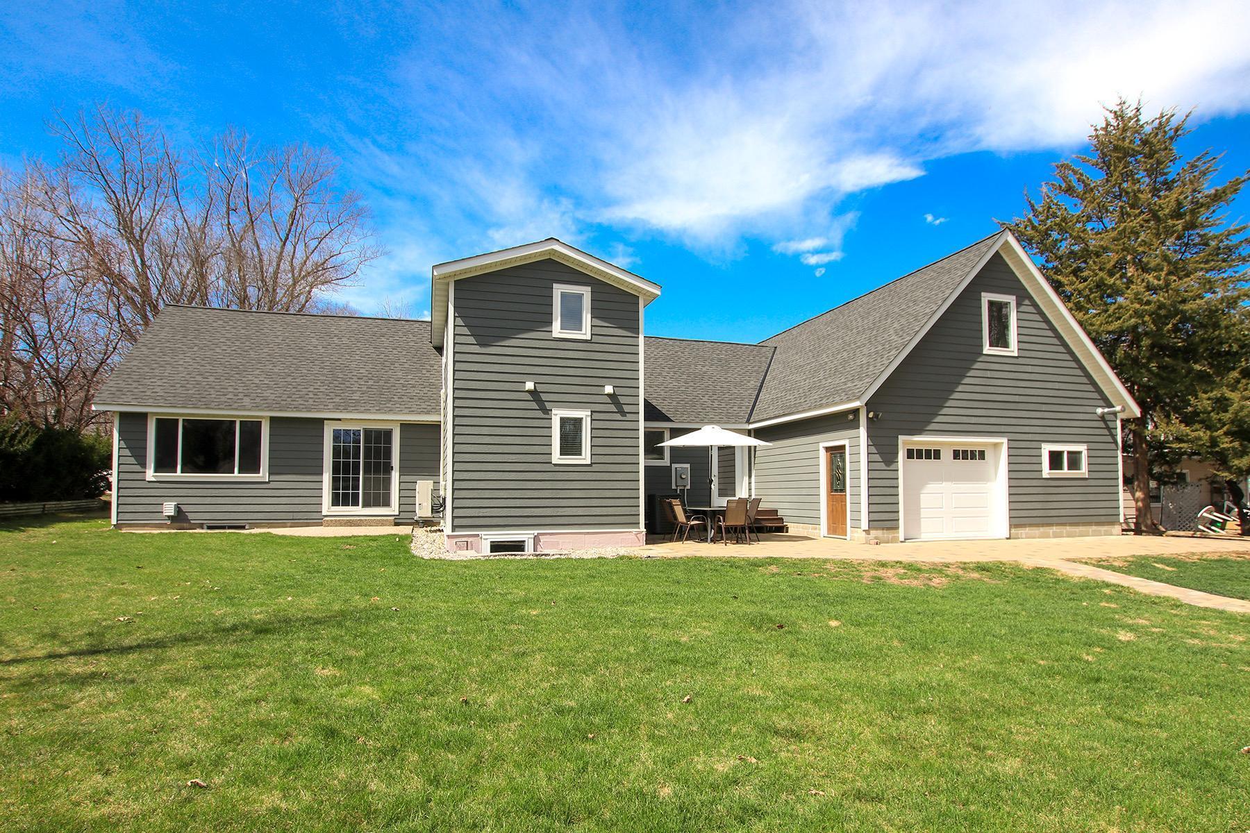 Back yard patio with pull through garage door