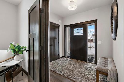 Large foyer with coat closet and French Doors leading to the main floor office
