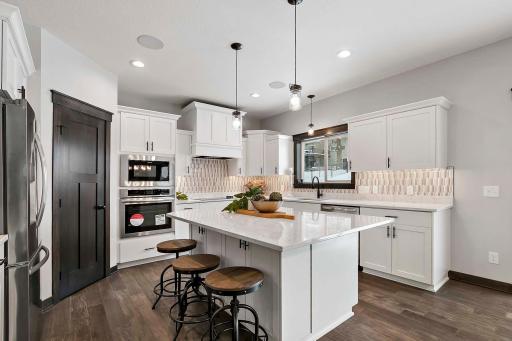 Granite tops, tile backsplash, stainless steel appliances