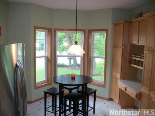 Eat-in kitchen with bay window.