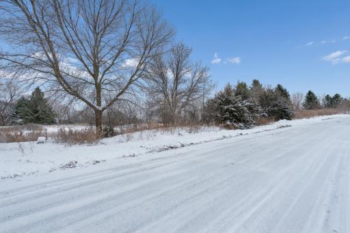 Paved road & street view of 2XX Stonebrooke Curve.