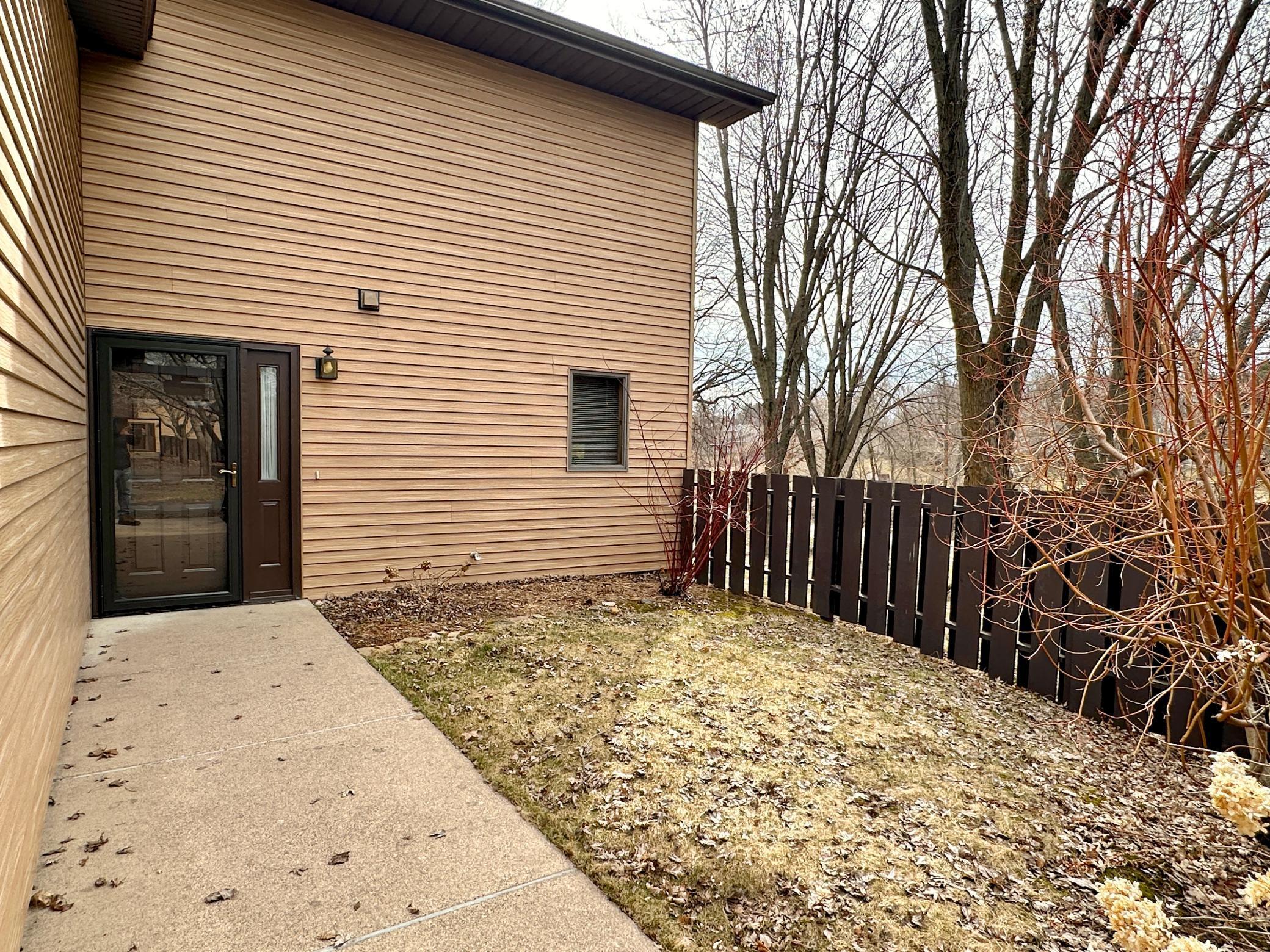 This front fenced in green space is great for pets.