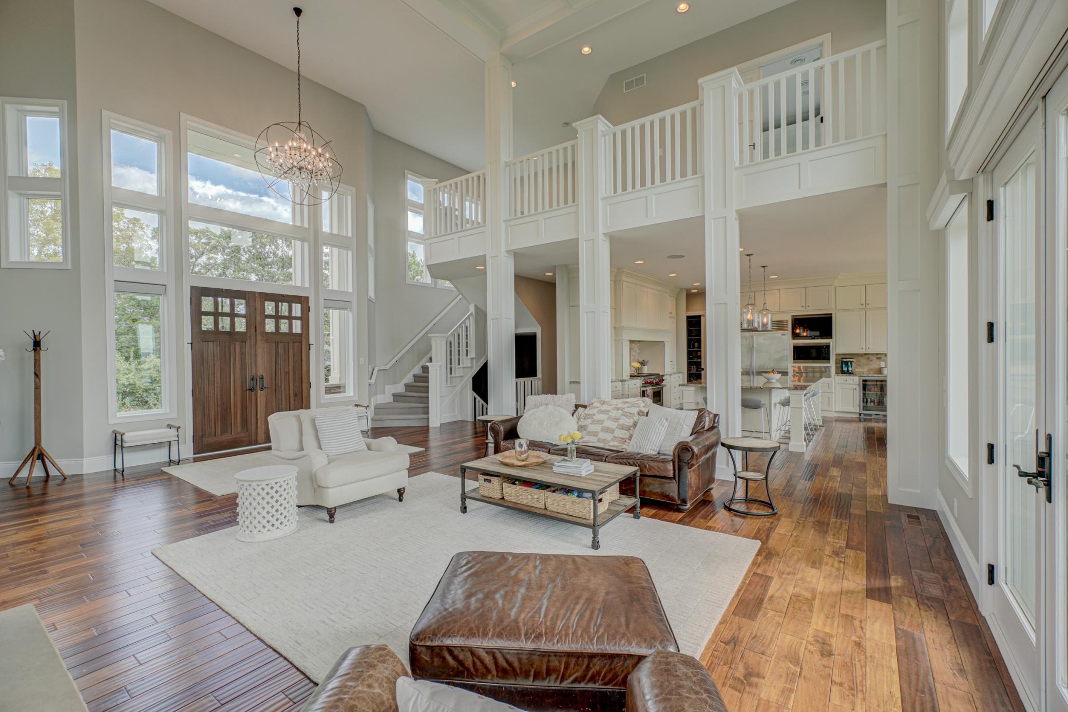 Step inside to soaring ceilings, rich hardwood floors, and walls of massive windows. Whole-home audio wiring with a Sonos system enhances every living space with effortless ambiance, perfect for entertaining or relaxing.