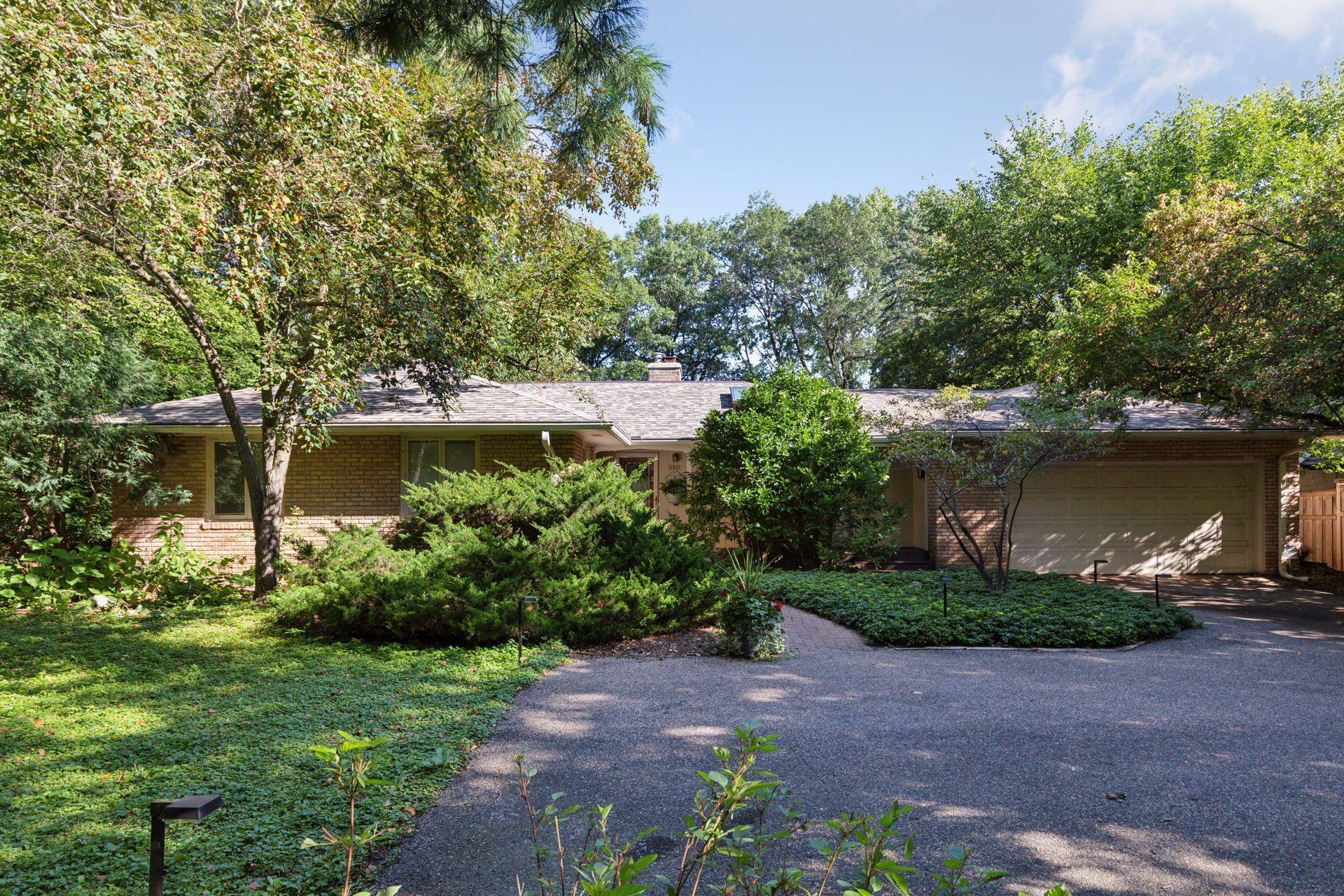 One level walkout is nestled in a very private setting...