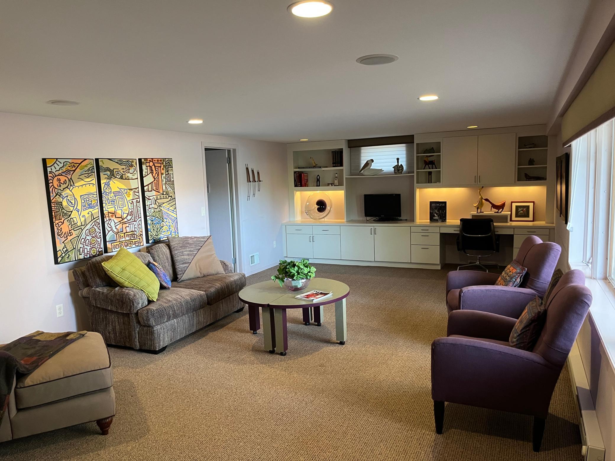 Lower level iving room has both lake views and a fireplace!