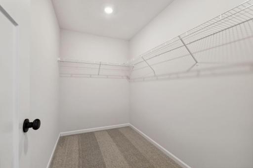 Owners Walk-in Closet with plenty of space for hanging your clothes and storage