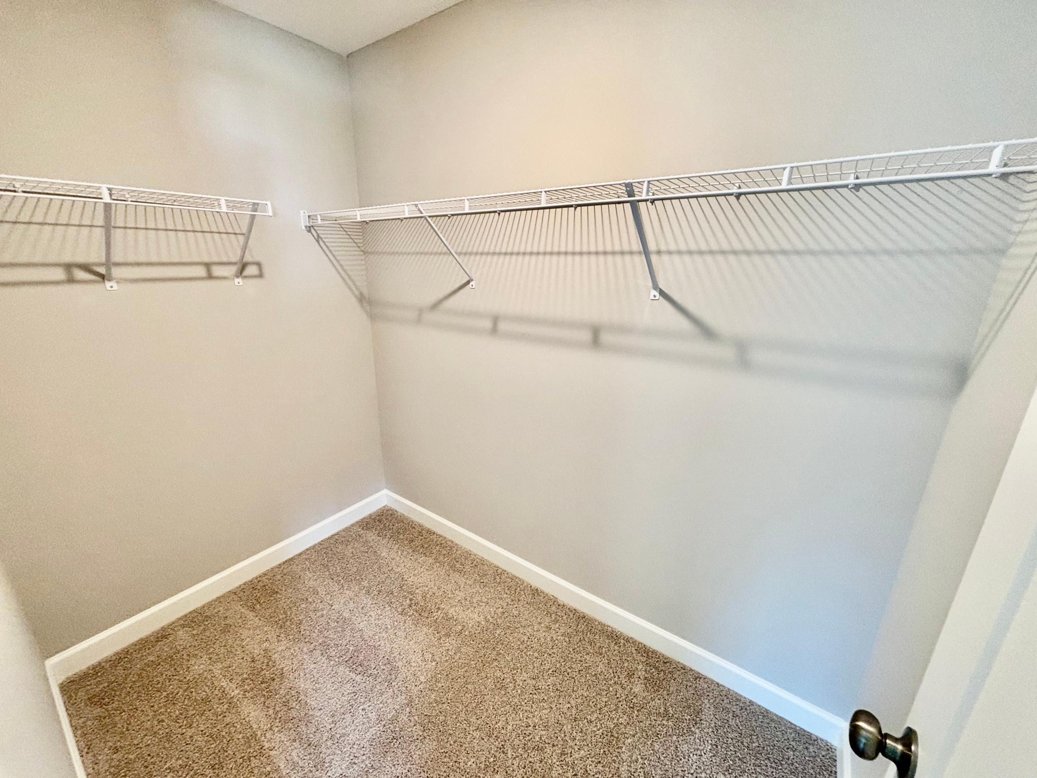 Primary Suite Walk-in Closet - The Weston at 11359 5th St NE in River's Edge!