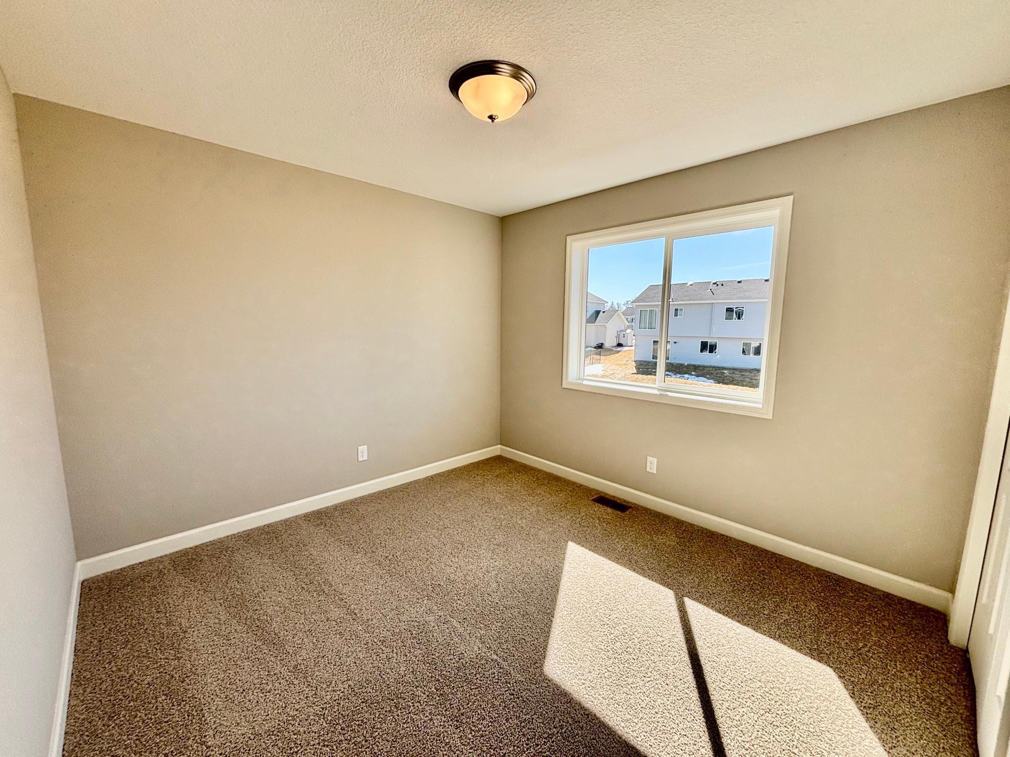 Upper Level Bedroom 3 - The Weston at 11359 5th St NE in River's Edge!