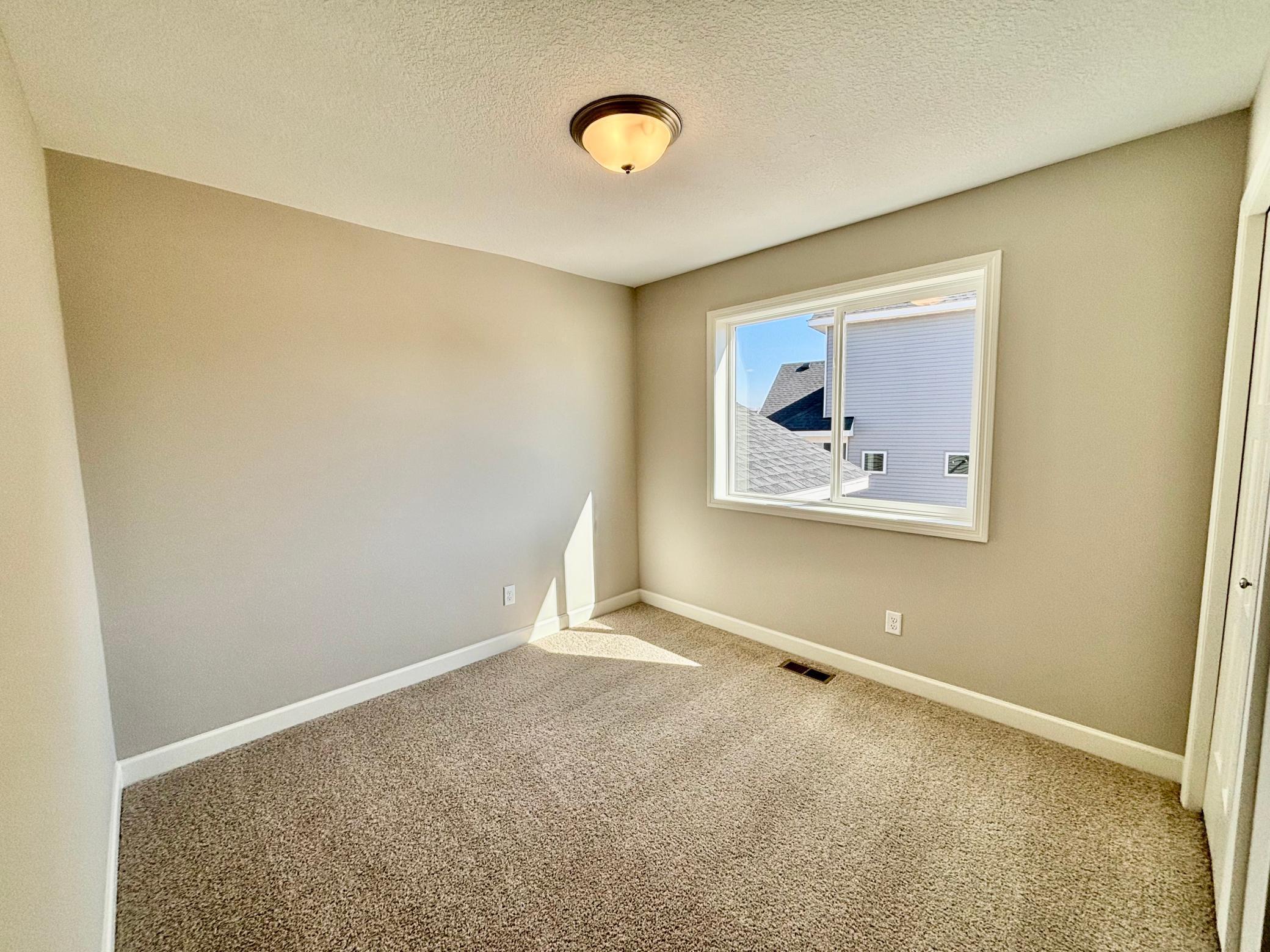 Lower Level Bedroom 4 - The Weston at 11359 5th St NE in River's Edge!