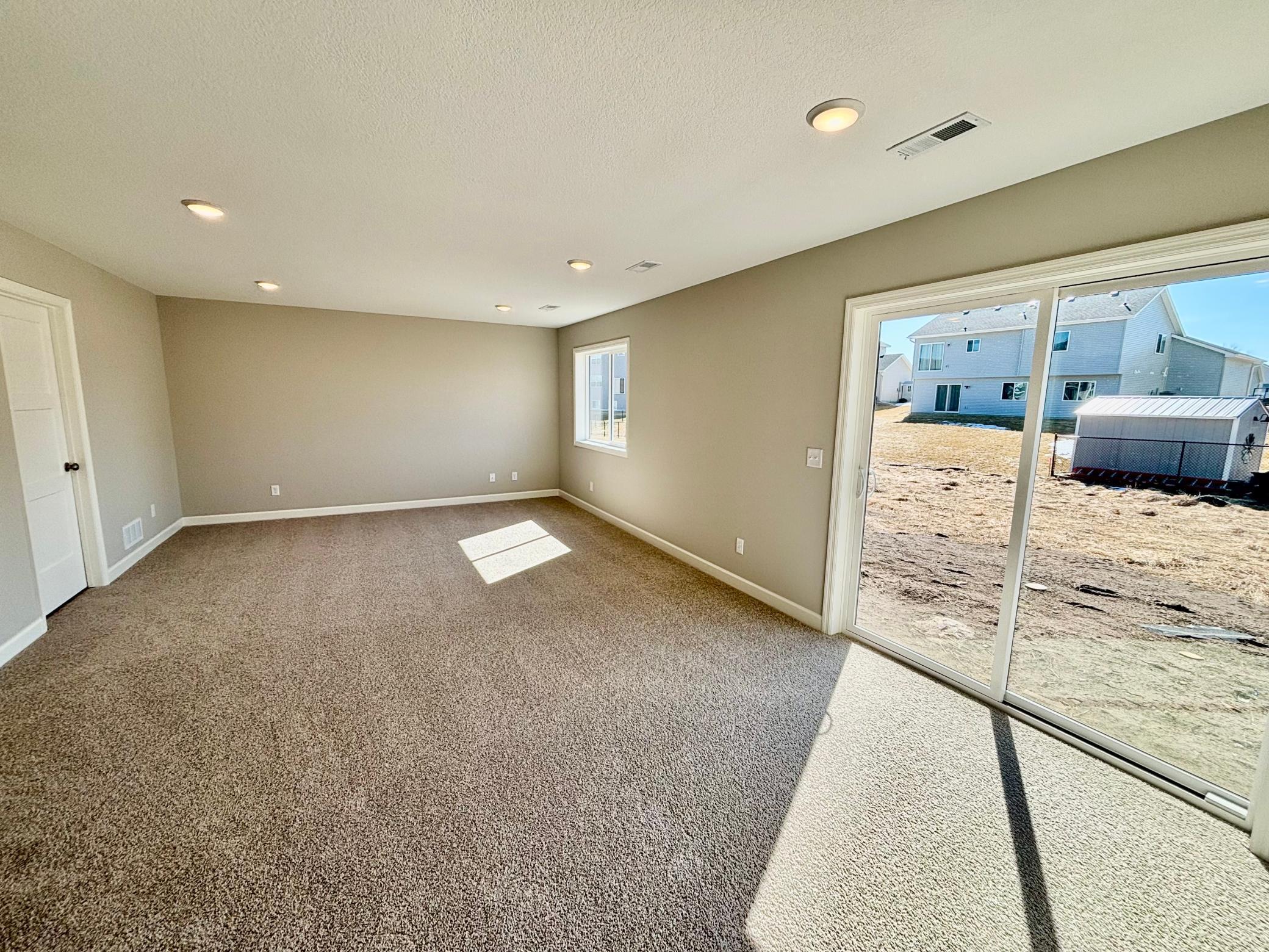 Lower Level Walkout Family Room - The Weston at 11359 5th St NE in River's Edge!
