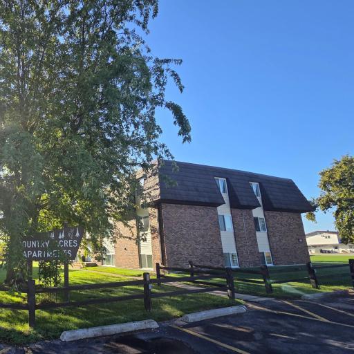 Country Acres Exterior with Property Sign.jpg