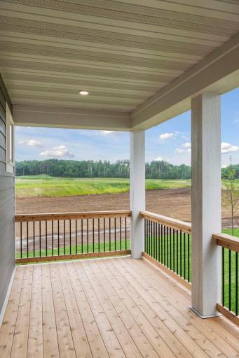This covered deck extends the living space outdoors, offering a peaceful, versatile spot to unwind and savor fresh air. Photos are of previously built home; options & features will vary.