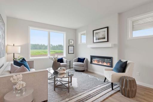 A cozy yet efficient gathering room filled with warmth & purpose. The space is blending comfort with smart design for a space that feels both welcoming & wonderfully practical. Photos are of previously built home; options and features will vary.