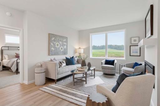 The gathering is open to the kitchen and dining area, this thoughtfully curated room is truly the heart of the home. Photos are of previously built home; options and features will vary..