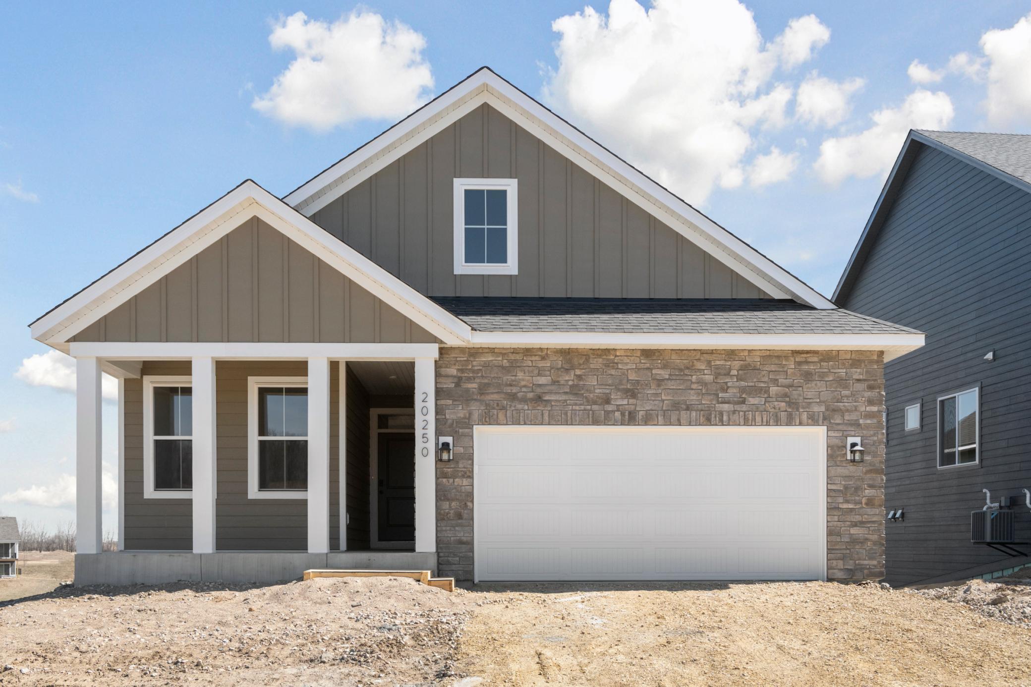 Exterior Elevation with Front Porch (driveway, landscaping, irrigation, and sod all included in the price)