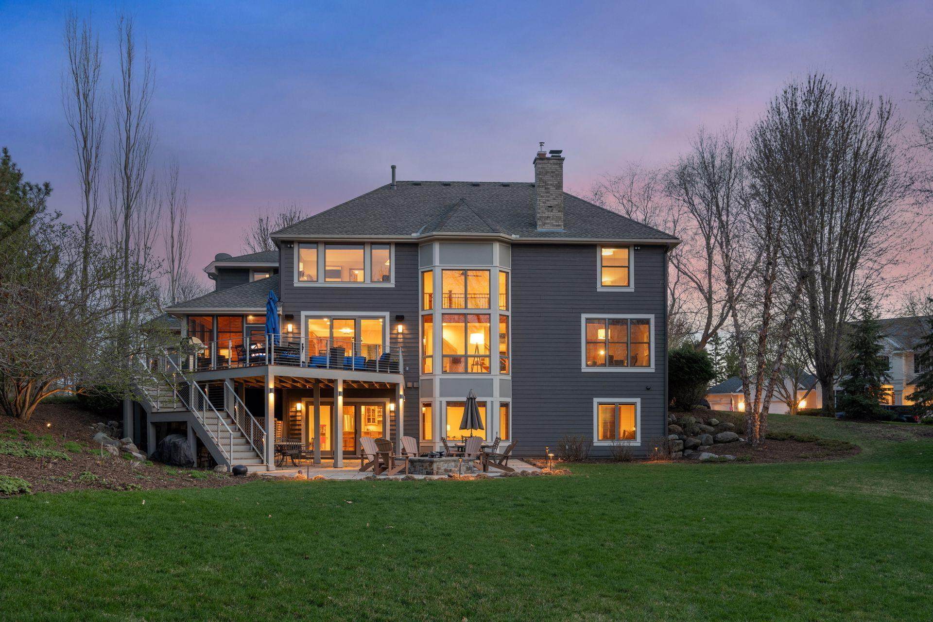 Expansive backyard with deck, patio, firepit. Landscape lighting and exterior sound speakers.