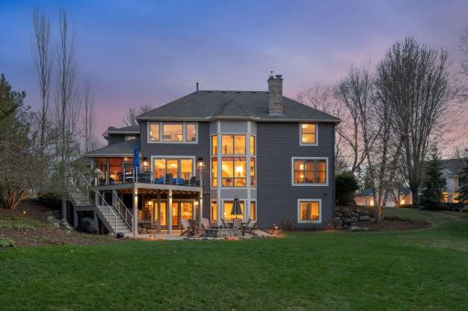 Expansive backyard with deck, patio, firepit. Landscape lighting and exterior sound speakers.