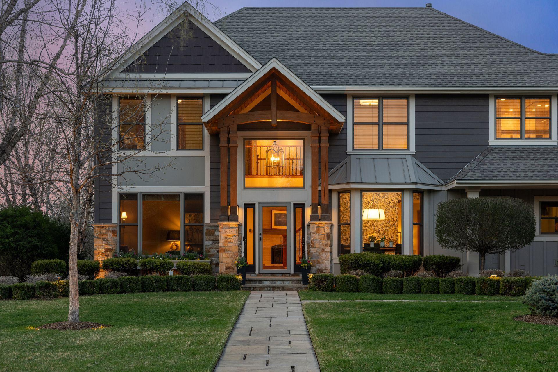 26950 Marsh Pointe Ct - front elevation stone and LP Smartside, Bay with standing metal seam, rebuilt portico.