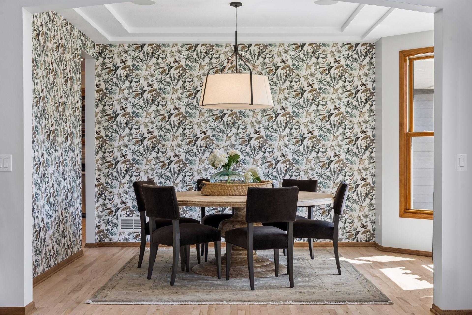 Dining room is filled with natural light plus hand-selected lighting and accent walls.