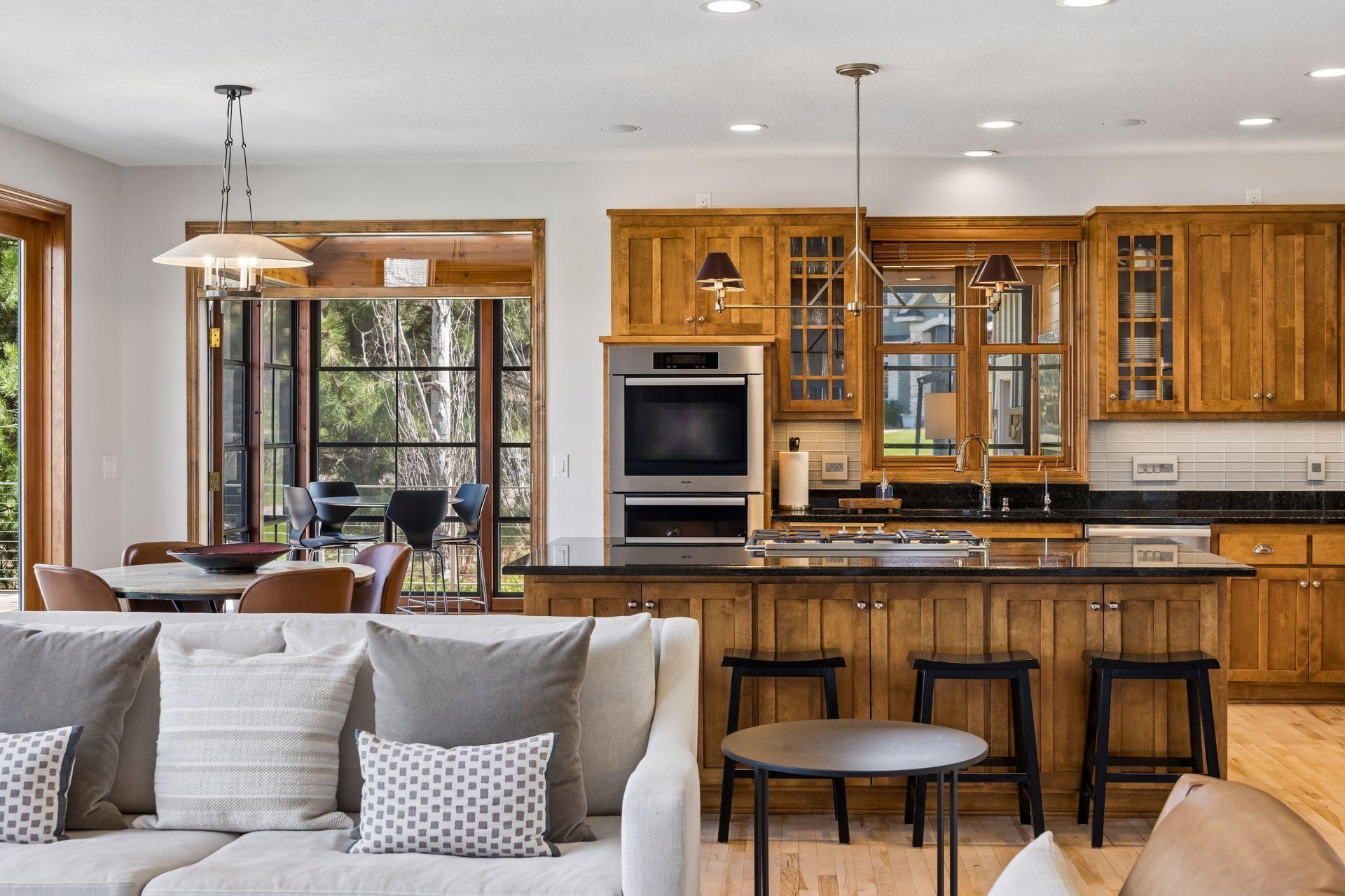 Chef's kitchen with double deep granite center island, abundant counter space and cabinet storge . Lovely backsplash, under cabinet lighting all embellished with Kohler polished nickel fixtures and new lighting.