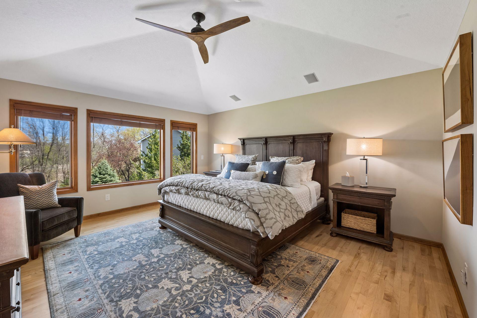 Primary suite bedroom. Abundant natural light. Space enough for furnishings plus a sweet reading area.