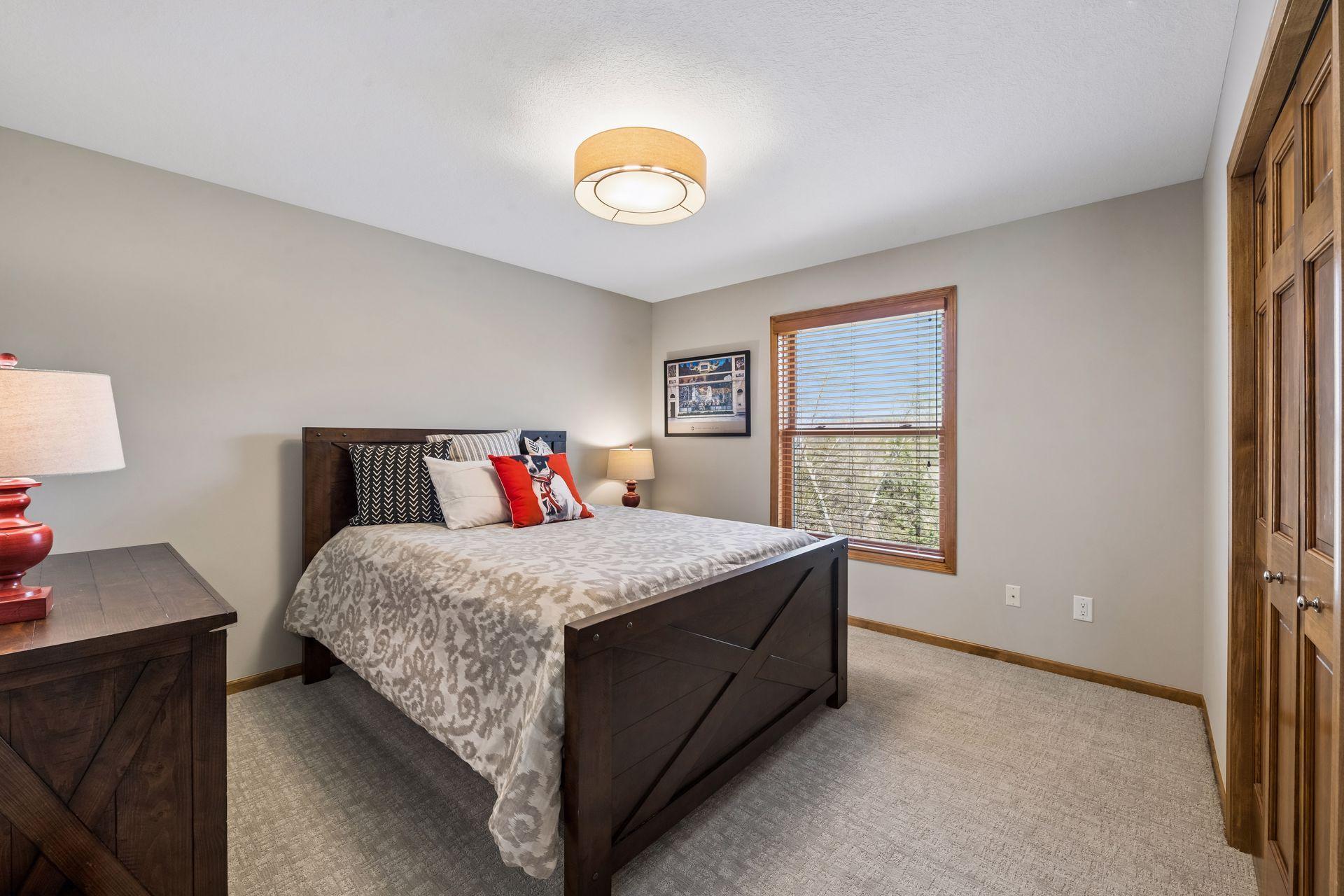 Upper level bedroom with new carpet and lighting - freshly painted, too.