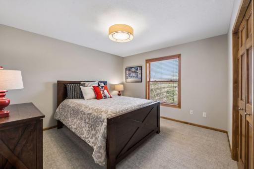 Upper level bedroom with new carpet and lighting - freshly painted, too.