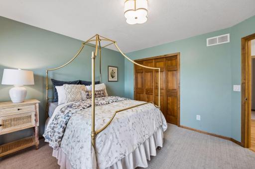 Upper level bedroom with new carpet and lighting - freshly painted, too.