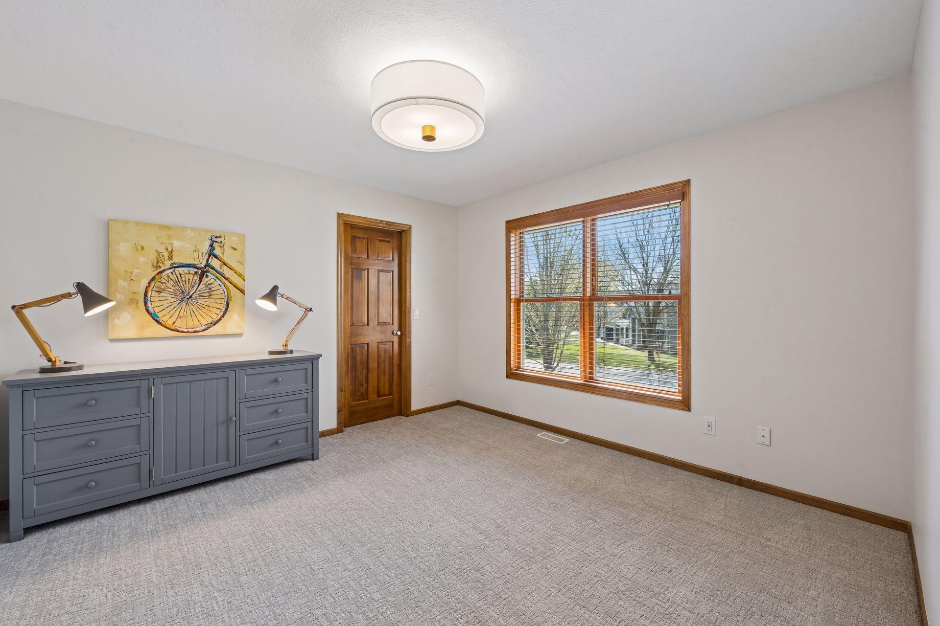 Upper level bedroom with new carpet and lighting - freshly painted, too.